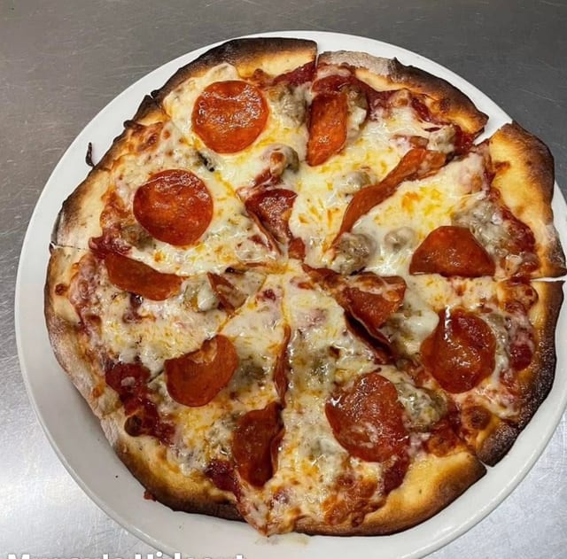 Personal Pizza two toppings with a side salad.